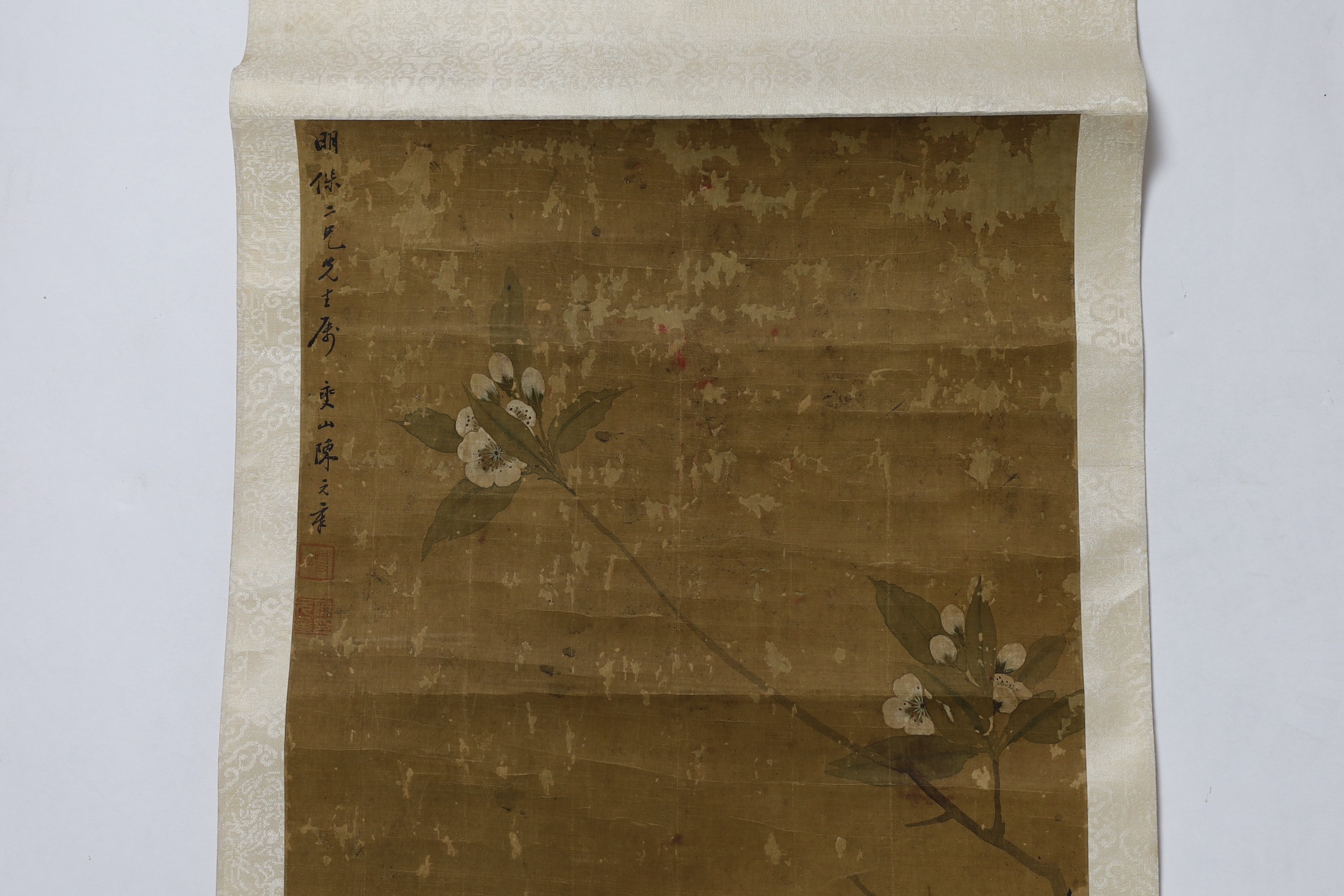 A Chinese scroll painting on silk of blackbirds perched on a blossoming branch, 19th century, image 79cm x 35cm